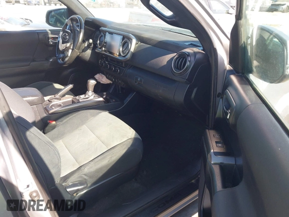 2021 Toyota Tacoma SR with VIN 3TMCZ5AN6MM393306, listed as a IAAI auction lot 42094095 with 57,217 mi miles and . Bid and sale history available at DreamBid. Image 5.