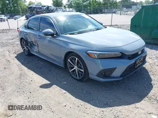 2024 Honda Civic Touring with VIN 2HGFE1F90RH323188, listed as a IAAI auction lot 42281249 with 33,401 mi miles and . Bid and sale history available at DreamBid. Image 1.