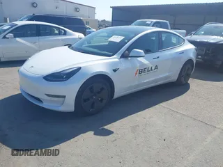 2022 Tesla Model 3 with VIN 5YJ3E1EA2NF245817, listed as a IAAI auction lot 41976493 with 32,710 mi miles and . Bid and sale history available at DreamBid. Image 2.