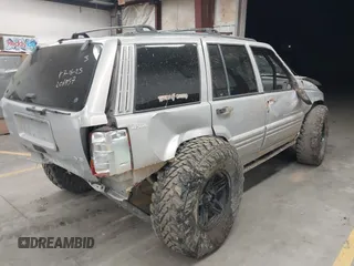 1998 Jeep Grand Cherokee Laredo with VIN 1J4GZ48Y9WC206957, listed as a IAAI auction lot 41848433 with 122,104 mi miles. Bid and sale history available at carsss.com. Image 4.
