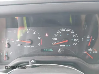 2002 Jeep Wrangler Sahara with VIN 1J4FA59S02P760345, listed as a IAAI auction lot 41634902 with 123,506 mi miles. Bid and sale history available at carsss.com. Image 7.