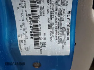 2007 Ford Focus S z VIN 1FAFP34N47W164846, wystawiony jako Copart lot #55587185 z przebiegiem 41 172 mil mil oraz Szkoda całkowita • Salvage title. Historia ofert i sprzedaży dostępna na DreamBid. Obrazek 13.