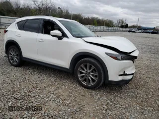 2021 Mazda CX-5 Grand Touring with VIN JM3KFBDM2M1436789, listed as a Copart auction lot 49534305 with 65,790 mi miles and Salvage Title. Bid and sale history available at carsss.com. Image 4.