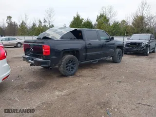 2016 Chevrolet Silverado 1500 LT with VIN 3GCUKREC6GG353660, listed as a IAAI auction lot 41240370 with 130,448 mi miles. Bid and sale history available at carsss.com. Image 4.