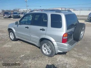 2003 Suzuki Grand Vitara with VIN JS3TD62V734105601, listed as a IAAI auction lot 42046825 with 210,728 mi miles. Bid and sale history available at carsss.com. Image 3.