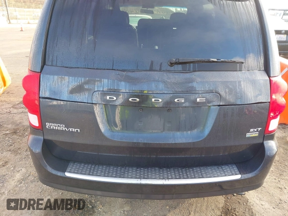 2014 Dodge Grand Caravan SXT with VIN 2C4RDGCG2ER267358, listed as a IAAI auction lot 41001692 with 186,763 mi miles and . Bid and sale history available at DreamBid. Image 6.