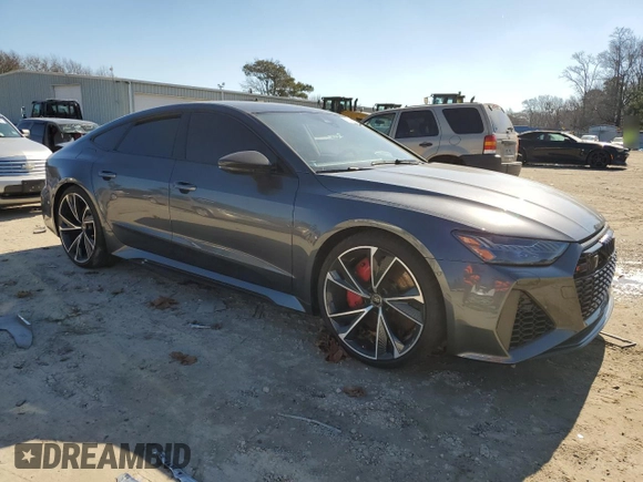 2022 Audi RS 7 z VIN WUAPCBF22NN912345, wystawiony jako Copart lot #41202044 z przebiegiem 5076 mil mil oraz Szkody całkowita. Historia ofert i sprzedaży dostępna na DreamBid. Obrazek 4.