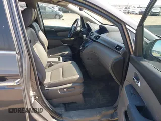 2014 Honda Odyssey EX-L z VIN 5FNRL5H64EB031426, wystawiony jako IAAI lot #41777542 z przebiegiem 162 426 mil mil oraz . Historia ofert i sprzedaży dostępna na DreamBid. Obrazek 5.