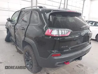2019 Jeep Cherokee Trailhawk with VIN 1C4PJMBX9KD456748, listed as a IAAI auction lot 42367186 with 91,665 mi miles and . Bid and sale history available at DreamBid. Image 3.