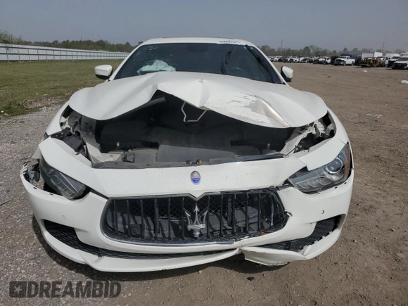 2017 Maserati Ghibli with VIN ZAM57XSA6H1233933, listed as a Copart auction lot 49089525 with 76,965 mi miles and Salvage Title. Bid and sale history available at carsss.com. Image 5.