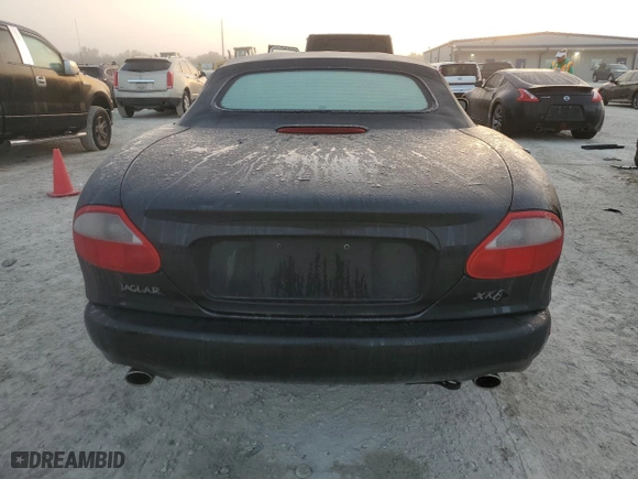 1997 Jaguar XK8 with VIN SAJGX2746VC005015, listed as a Copart auction lot 76176284 with 0 mi miles and Non Repairable. Bid and sale history available at carsss.com. Image 6.