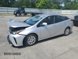2021 Toyota Prius L Eco z VIN JTDKAMFU4M3150656, wystawiony jako Copart lot #55959805 z przebiegiem 120 146 mil mil oraz Szkoda całkowita • Salvage title. Historia ofert i sprzedaży dostępna na DreamBid. Obrazek 1.