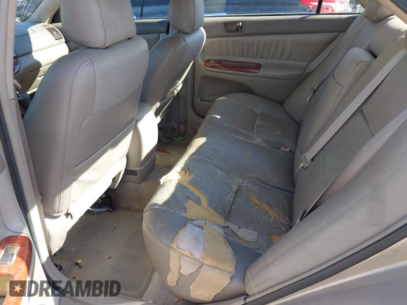 2002 Toyota Camry LE z VIN 4T1BE32K02U051709, wystawiony jako IAAI lot #41485620 z przebiegiem 232 876 mil mil oraz . Historia ofert i sprzedaży dostępna na DreamBid. Obrazek 8.