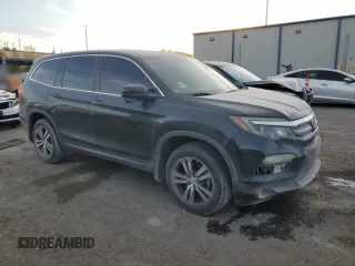 2016 Honda Pilot EX-L with VIN 5FNYF6H72GB106385, listed as a Copart auction lot 44000395 with 128,520 mi miles and Salvage Title. Bid and sale history available at carsss.com. Image 4.