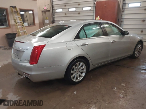 2014 Cadillac CTS Luxury AWD with VIN 1G6AX5S3XE0158960, listed as a IAAI auction lot 41258609 with 84,360 mi miles and . Bid and sale history available at DreamBid. Image 4.