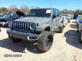 2020 Jeep Gladiator Overland z VIN 1C6HJTFG4LL143369, wystawiony jako IAAI lot #41827409 z przebiegiem 77 752 mil mil oraz . Historia ofert i sprzedaży dostępna na DreamBid. Obrazek 2.
