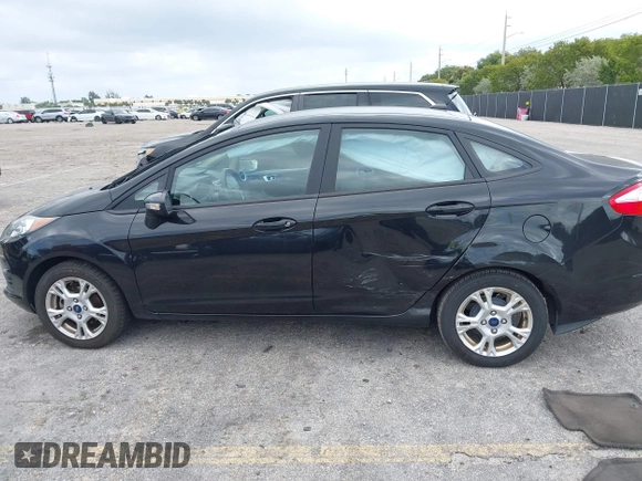2015 Ford Fiesta SE with VIN 3FADP4BJ5FM130099, listed as a IAAI auction lot 42126960 with 82,299 mi miles and . Bid and sale history available at DreamBid. Image 14.