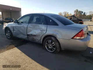 2005 Mercury Montego Premier with VIN 1MEFM43165G608323, listed as a Copart auction lot 77156404 with 138,150 mi miles and Salvage Title. Bid and sale history available at carsss.com. Image 2.