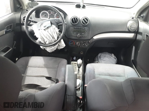 2007 Chevrolet Aveo LS z VIN KL1TD56627B175107, wystawiony jako Copart lot #51242365 z przebiegiem Nie podano mil oraz Szkoda całkowita • Salvage title. Historia ofert i sprzedaży dostępna na DreamBid. Obrazek 8.