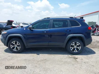 2015 Jeep Cherokee Trailhawk with VIN 1C4PJMBS3FW704622, listed as a IAAI auction lot 42465702 with 96,831 mi miles and . Bid and sale history available at DreamBid. Image 14.