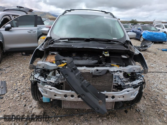 2016 Ford Escape SE z VIN 1FMCU0G91GUC59990, wystawiony jako Copart lot #56956395 z przebiegiem 112 706 mil mil oraz Szkoda całkowita • Salvage title. Historia ofert i sprzedaży dostępna na DreamBid. Obrazek 5.