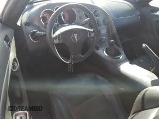 2006 Pontiac Solstice z VIN 1G2MB35B56Y116249, wystawiony jako Copart lot #77471704 z przebiegiem Nie podano mil oraz Nie do naprawy • Non repairable. Historia ofert i sprzedaży dostępna na DreamBid. Obrazek 8.