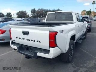 2024 Toyota Tacoma 4WD SR5 with VIN 3TYLB5JNXRT007339, listed as a IAAI auction lot 41432778 with 4,038 mi miles. Bid and sale history available at carsss.com. Image 4.