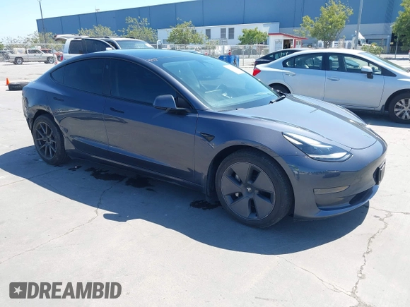 2023 Tesla Model 3 with VIN 5YJ3E1EAXPF405588, listed as a IAAI auction lot 42348952 with 30,788 mi miles and . Bid and sale history available at DreamBid. Image 1.