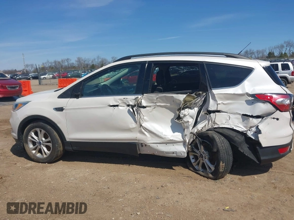 2018 Ford Escape SE z VIN 1FMCU9GD4JUB06181, wystawiony jako IAAI lot #42046708 z przebiegiem 160 987 mil mil oraz . Historia ofert i sprzedaży dostępna na DreamBid. Obrazek 15.