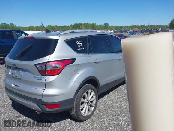 2018 Ford Escape Titanium with VIN 1FMCU9J96JUA33500, listed as a IAAI auction lot 42121736 with 105,430 mi miles and . Bid and sale history available at DreamBid. Image 4.