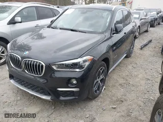 2018 BMW X1 xDrive28i with VIN WBXHT3C34J5K21576, listed as a IAAI auction lot 41822390 with 69,645 mi miles. Bid and sale history available at carsss.com. Image 2.