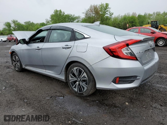 2017 Honda Civic EX-L z VIN 19XFC1F74HE209787, wystawiony jako Copart lot #56352415 z przebiegiem 130 264 mil mil oraz Szkoda całkowita • Salvage title. Historia ofert i sprzedaży dostępna na DreamBid. Obrazek 2.