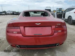 2005 Aston Martin DB9 z VIN SCFAD01A15GA00012, wystawiony jako Copart lot #65919164 z przebiegiem Nie podano mil oraz Szkody całkowita. Historia ofert i sprzedaży dostępna na DreamBid. Obrazek 6.