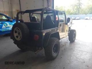 1999 Jeep Wrangler Sport with VIN 1J4FY19S4XP494405, listed as a IAAI auction lot 42542416 with 168,856 mi miles and . Bid and sale history available at DreamBid. Image 4.