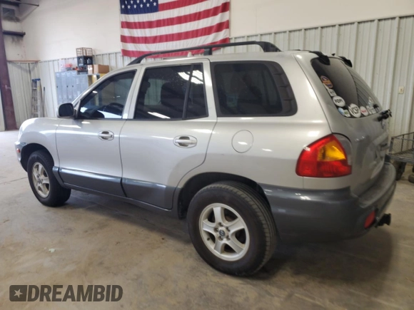 2003 Hyundai Santa Fe GLS z VIN KM8SC13DX3U431975, wystawiony jako Copart lot #56180275 z przebiegiem 239 295 mil mil oraz Czysty tytuł • Clean title. Historia ofert i sprzedaży dostępna na DreamBid. Obrazek 2.