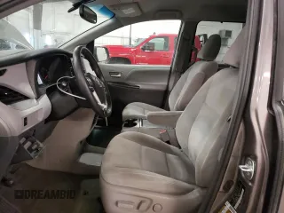 2016 Toyota Sienna LE with VIN 5TDJK3DC5GS146048, listed as a Copart auction lot 69964964 with 133,935 mi miles and Salvage Title. Bid and sale history available at carsss.com. Image 7.