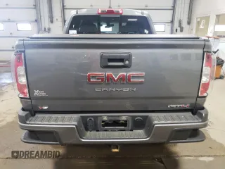 2021 GMC Canyon 4WD AT4 z VIN 1GTG6FEN1M1203936, wystawiony jako Copart lot #56041315 z przebiegiem 54 939 mil mil oraz Szkoda całkowita • Salvage title. Historia ofert i sprzedaży dostępna na DreamBid. Obrazek 6.