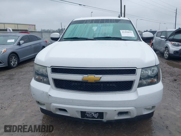 2014 Chevrolet Suburban LT with VIN 1GNSCJE06ER154639, listed as a IAAI auction lot 41410623 with 213,592 mi miles. Bid and sale history available at carsss.com. Image 12.