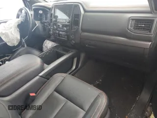2021 Nissan Titan Pro-4X with VIN 1N6AA1ED0MN528002, listed as a Copart auction lot 54779885 with 33,235 mi miles and Salvage title. Bid and sale history available at DreamBid. Image 8.