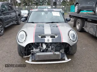 2017 MINI Hardtop 4 Door Cooper S z VIN WMWXU3C58H2D33073, wystawiony jako IAAI lot #41913081 z przebiegiem 51 631 mil mil oraz . Historia ofert i sprzedaży dostępna na DreamBid. Obrazek 13.
