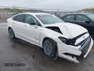 2017 Ford Fusion Hybrid Titanium z VIN 3FA6P0RUXHR317572, wystawiony jako IAAI lot #42170169 z przebiegiem 138 987 mil mil oraz . Historia ofert i sprzedaży dostępna na DreamBid. Obrazek 1.