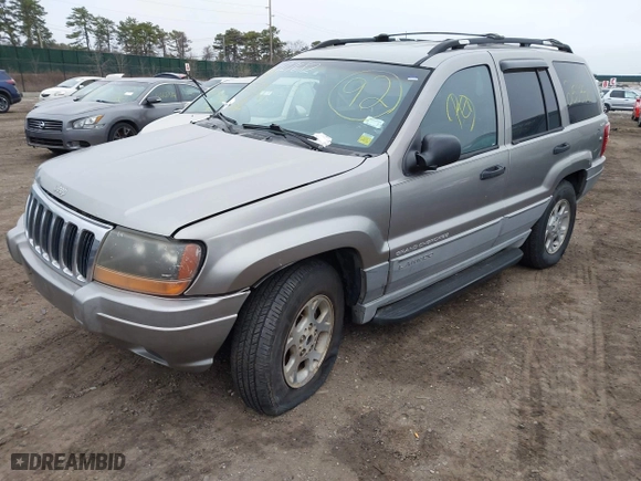 1999 Jeep Grand Cherokee Laredo with VIN 1J4GW58S9XC673310, listed as a IAAI auction lot 41927682 with 999,999 mi miles. Bid and sale history available at carsss.com. Image 2.