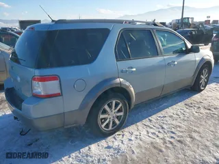 2008 Ford Taurus X SEL with VIN 1FMDK05W78GA20642, listed as a IAAI auction lot 41330080 with 128,928 mi miles. Bid and sale history available at carsss.com. Image 4.