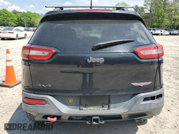 2014 Jeep Cherokee Trailhawk with VIN 1C4PJMBS1EW242527, listed as a Copart auction lot 53160485 with 104,074 mi miles and Salvage Title. Bid and sale history available at carsss.com. Image 6.