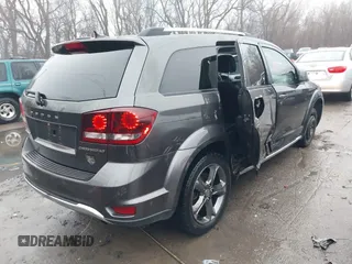 2017 Dodge Journey Crossroad Plus z VIN 3C4PDCGB5HT501363, wystawiony jako IAAI lot #41178334 z przebiegiem 119 076 mil mil oraz . Historia ofert i sprzedaży dostępna na DreamBid. Obrazek 4.