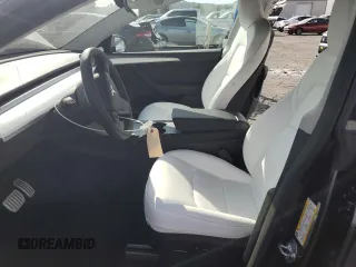 2024 Tesla Model Y Performance with VIN 7SAYGDEF7RF093054, listed as a Copart auction lot 50747985 with 26,907 mi miles and Salvage Title. Bid and sale history available at DreamBid. Image 7.