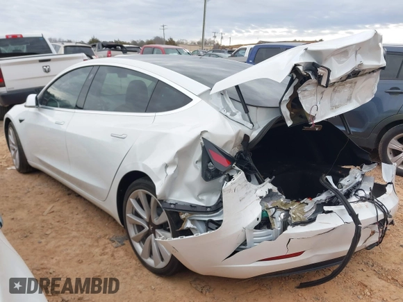 2020 Tesla Model 3 Standard Range Plus with VIN 5YJ3E1EA1LF738062, listed as a IAAI auction lot 41747581 with 41,897 mi miles. Bid and sale history available at carsss.com. Image 3.