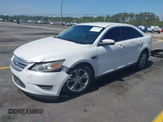 2014 Ford Taurus SEL with VIN 1FAHP2E86EG132676, listed as a IAAI auction lot 41943392 with 183,633 mi miles. Bid and sale history available at carsss.com. Image 2.