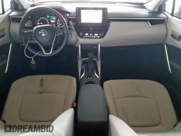 2023 Toyota Corolla Cross LE with VIN 7MUBAAAG4PV042580, listed as a Copart auction lot 63797305 with 59,576 mi miles and Salvage title. Bid and sale history available at DreamBid. Image 8.
