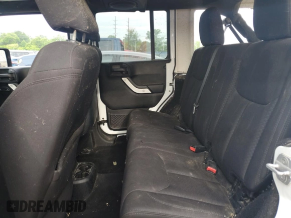 2013 Jeep Wrangler Unlimited Sport z VIN 1C4BJWDG0DL574795, wystawiony jako Copart lot #59230515 z przebiegiem 132 808 mil mil oraz Szkoda całkowita • Salvage title. Historia ofert i sprzedaży dostępna na DreamBid. Obrazek 11.